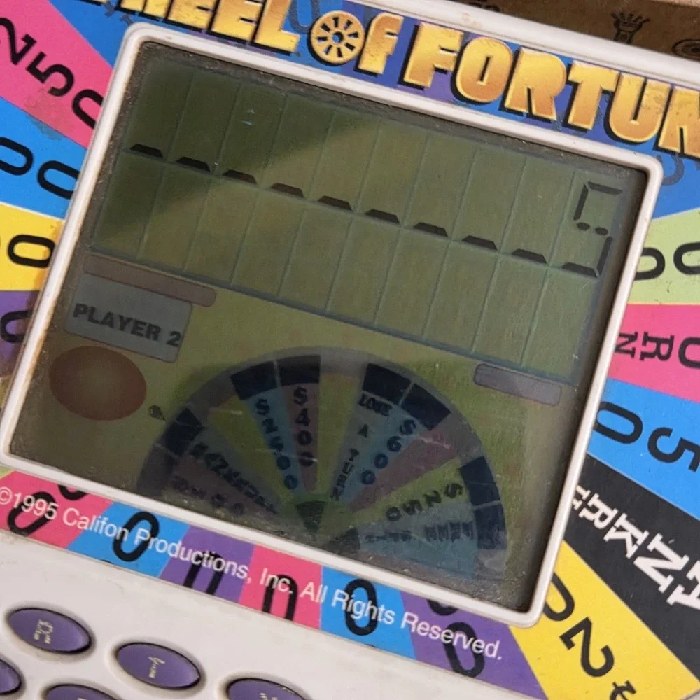 Vintage Wheel of Fortune Handheld Electronic Game Cartridges Tiger 1995 - TESTED